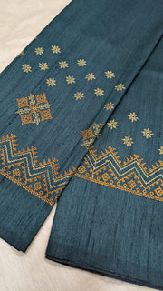 Side angled view of deep green blouse showing kasuti motifs